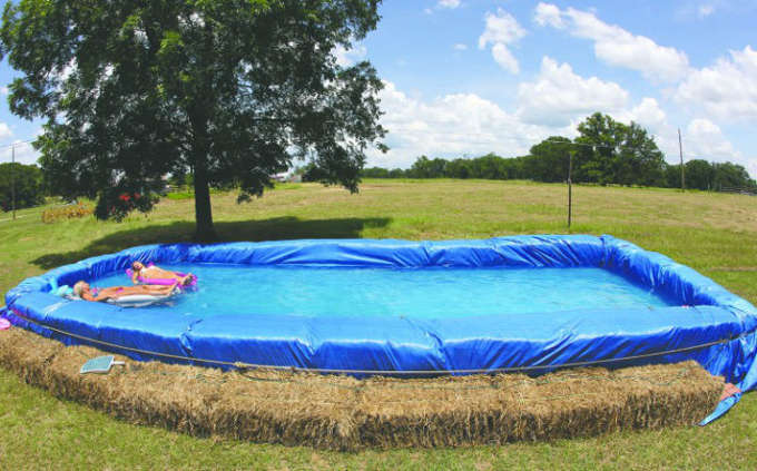 Diy swimming pool with straw bales
